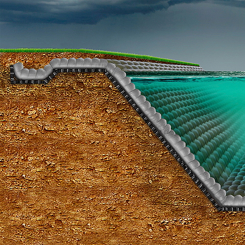 Bacia de retenção de águas pluviais vedada por um sistema de tapete de concreto geossintético
